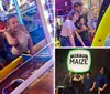 A family is happily playing a game of skee-ball in an arcade