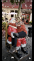 Kissing Santa near Rick Thomas Illusionist and Magic Show