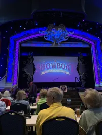 The image shows a theater stage set for