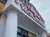 The image shows the entrance of the Hollywood Wax Museum with a large gorilla figure perched on the roof.