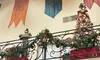 The image shows a festive interior with Christmas decorations, banners, a suit of armor, and photos on the walls.