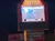 The image shows a brightly lit sign for the 