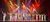 A group of performers takes a bow on stage under colorful and dramatic lighting.