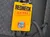 A yellow lanyard card titled 