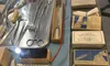 The image shows a display of vintage medical tools and supplies, including scissors, gauze bandages, safety pins, and ammonia ampoules, arranged on a blue cloth.