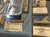 The image shows a display of vintage medical tools and supplies, including scissors, gauze bandages, safety pins, and ammonia ampoules, arranged on a blue cloth.