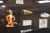 The image shows a display case containing various fishing lures, including a colorful character-themed lure.