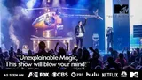 A performer stands on stage next to a levitating helicopter, surrounded by a cheering audience, with a quote praising the show as unexplainable magic and logos of various TV networks displayed.