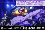 A performer stands on stage next to a helicopter with dramatic lighting, a flowing fabric, and a text quote praising an unexplainable magic show, accompanied by logos of various networks.
