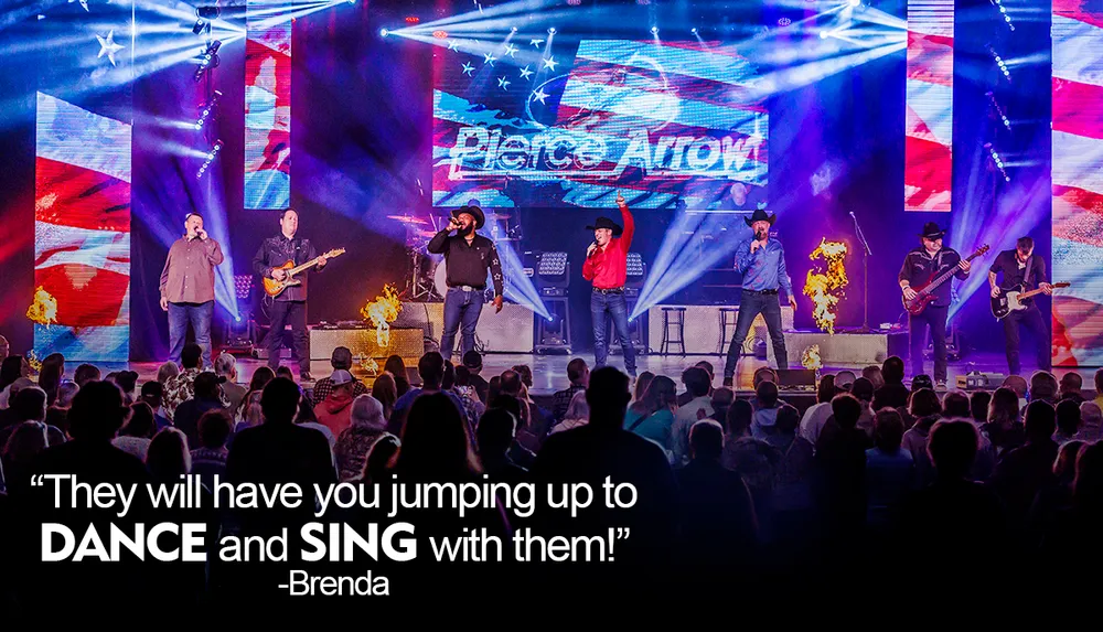 A band performs energetically on stage with vibrant lighting surrounded by flames and a cheering audience accompanied by a quote praising their ability to make people dance and sing