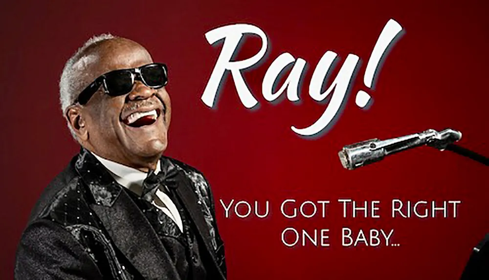The image shows a smiling man wearing sunglasses and a tuxedo in front of a red background with the text Ray and a tagline You Got the Right One Baby along with a classic microphone which suggests its a promotional material likely for a music-related subject