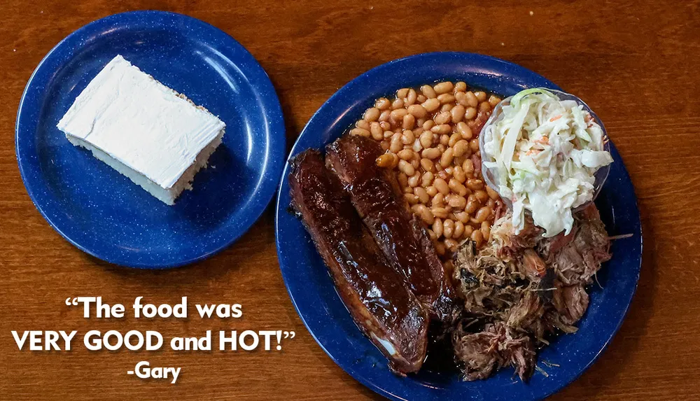 A plate of barbecue food with ribs baked beans coleslaw and pulled pork is shown alongside a slice of cake with a quote saying The food was VERY GOOD and HOT