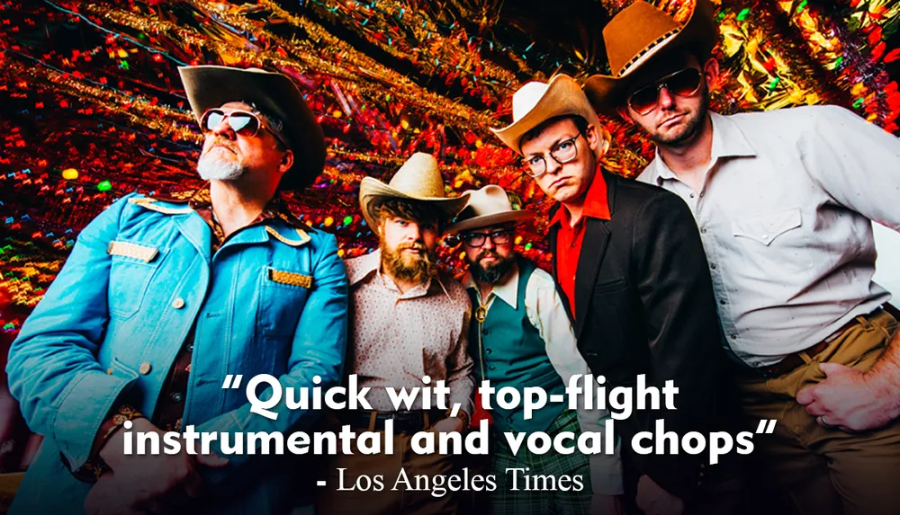 A group of five men sporting cowboy hats and eclectic outfits pose confidently with a festive colorful tinsel background accompanied by a quote praising their wit and musical talent attributed to the Los Angeles Times