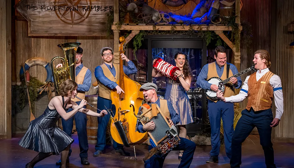 A lively band performs on stage featuring musicians playing a variety of instruments in a festive setting