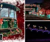 A vintage-style trolley is decorated with festive Christmas wreaths and bows set against a seasonal background with snowflake decorations