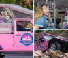 A pink Jeep is navigating a rocky off-road terrain amidst trees and rough slopes