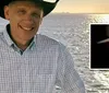 A person wearing a cowboy hat is standing in front of a body of water during a bright sunny day