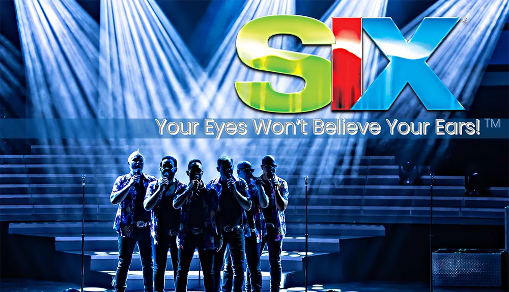 The image features a group of performers on stage under dramatic lighting with the logo SIX and the tagline Your Eyes Wont Believe Your Ears above them