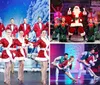 A person in a snowman costume is surrounded by smiling dancers in festive outfits on a winter-themed stage