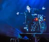 The image promotes a highly acclaimed magic show featuring a performer levitating a woman with enthusiastic reviews and accolades like Illusionist of the World and a 1 show rating