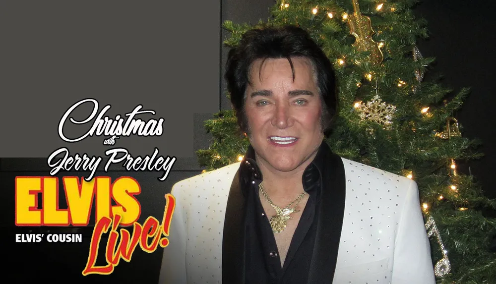 A person resembling Elvis Presley stands in front of a Christmas tree with a backdrop that reads Elvis Live
