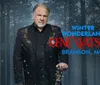 The image features a man in a decorated suit holding a guitar against a forest background with text saying Winter Wonderland Gene Watson Branson MO