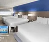 The image shows a modern hotel room with three beds a blue accent wall and amenities including free hot breakfast an outdoor pool and free Wi-Fi