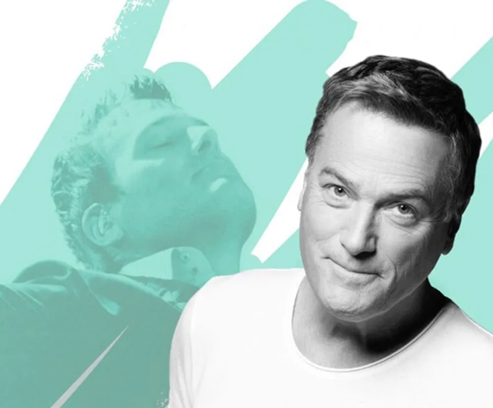 The image depicts a man in a white shirt smiling at the camera with a stylized overlay of the same person in profile cast in a teal color