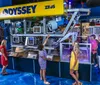 Visitors are examining a large underwater remotely operated vehicle ROV named ZEUS from Odyssey on display at a museum or exhibition