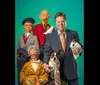 A man sits beside a piano with a dog three ventriloquist puppets a bird and a rabbit in a top hat