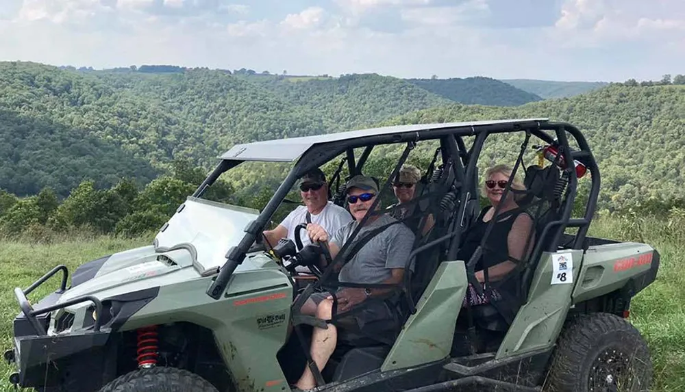 A group of people are enjoying a scenic off-road adventure in a utility terrain vehicle